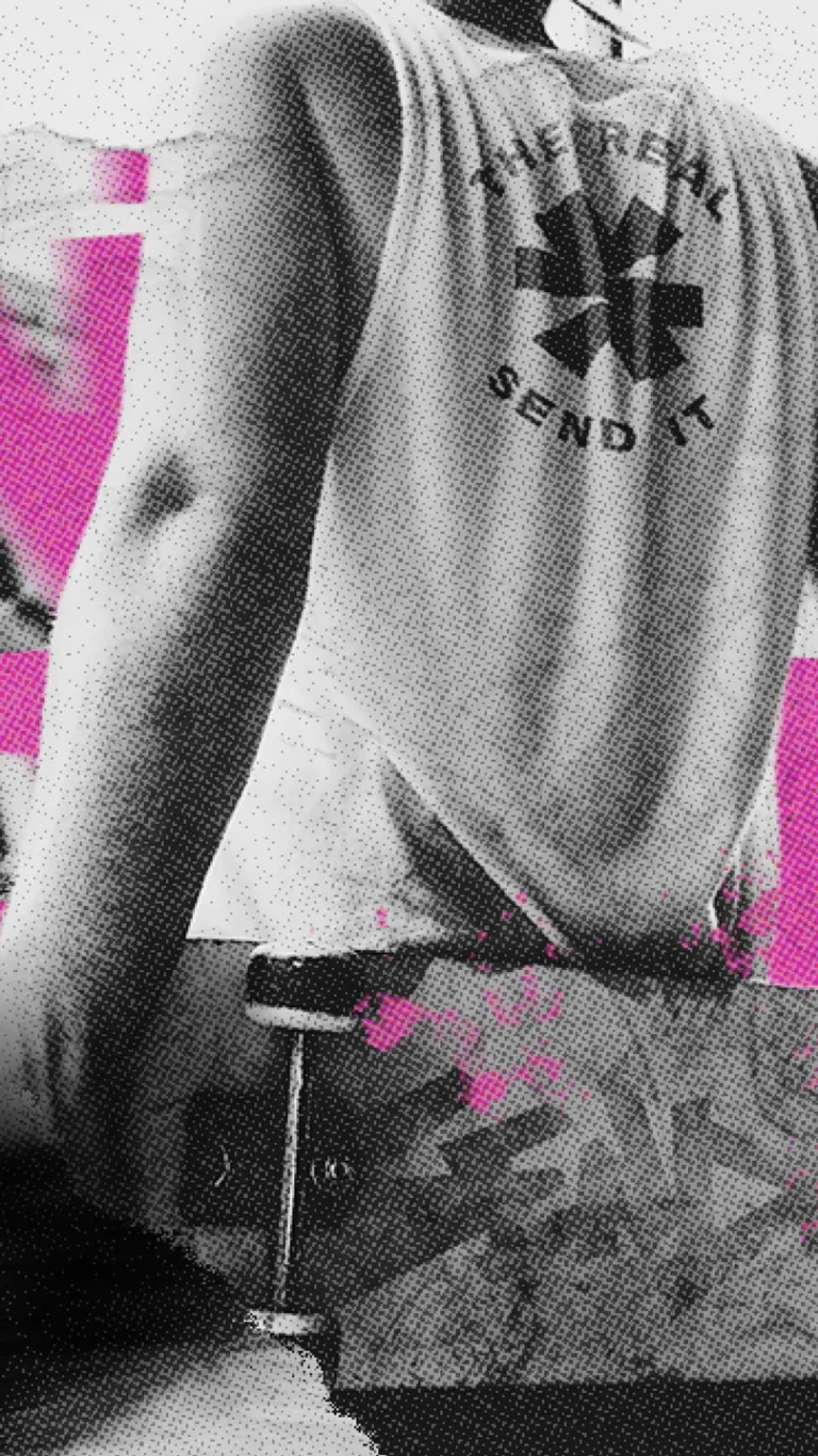 person holding a sendit skateboard repping a send it t-shirt with graffiti over top